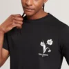 CAHEL Floral Logo Graphic Cotton T-Shirt